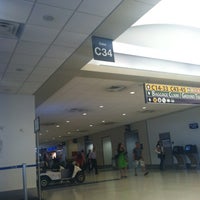Photo taken at Gate C34 by Kimmy G. on 6/16/2012