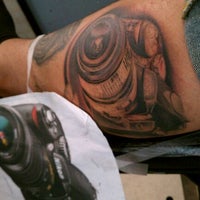 Photo taken at Coy Fish Tattoo by Tony Z. on 10/28/2011