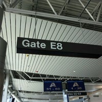 Photo taken at Gate E8 by Courtney T. on 6/25/2012