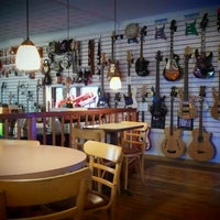 Photo taken at Tommy&amp;#39;s Guitars and Café by Leona L. on 1/12/2012