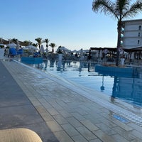 Photo taken at Asterias Beach Hotel by Vassilis P. on 7/1/2022