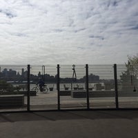 Photo taken at East River Esplanade South Dog Run by Mona H. on 4/30/2016