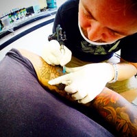 Photo taken at Gugo Tattoo by William A. on 9/12/2014