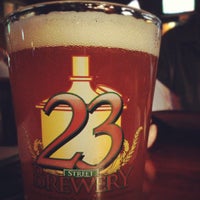 Photo taken at 23rd Street Brewery by Laura K. on 11/24/2012