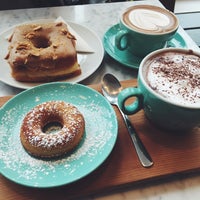 Photo taken at 49th Parallel &amp;amp; Lucky&amp;#39;s Doughnuts by meru on 1/22/2015
