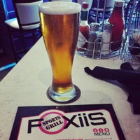 Photo taken at Foxiis Sports Grill by Adam E. on 7/4/2013