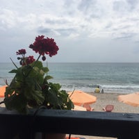 Photo taken at Stelakis Beach by Sezin S. on 8/9/2016