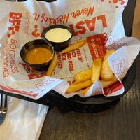 Photo taken at Red Robin Gourmet Burgers and Brews by Derek L. on 12/5/2020