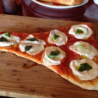 Photo taken at Crust Pizzeria and Ristorante by Jennifer S. on 8/31/2014