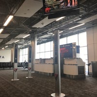 Photo taken at Gate T4 by Gregory G. on 4/19/2017