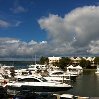 Photo taken at Runaway Bay Marina by Kelly M. on 4/13/2012