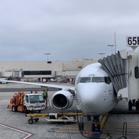 Photo taken at Gate 65B by Adrian L. on 7/7/2019