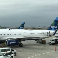 Photo taken at Gate 21 by Adrian L. on 5/12/2018