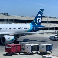 Photo taken at Gate 60 by Adrian L. on 8/2/2019