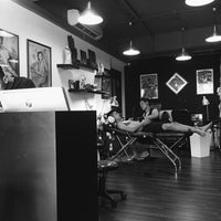 Photo taken at Oracle Tattoo by Geraldine A. on 2/26/2016