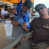 Photo taken at Tides Beach Bar &amp;amp; Grille by Tara D. on 6/30/2019