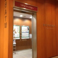 Photo taken at Resona Bank Tokyo Midtown Branch Plaza B1F Branch Office by Tear S. on 1/5/2013