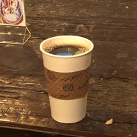 Photo taken at Black Cat Coffee by Andrew F. on 1/1/2018