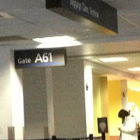 Photo taken at Gate A61 by Eva G. on 1/1/2013