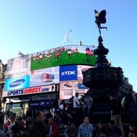 Photo taken at Piccadilly Circus by Olya S. on 5/1/2013