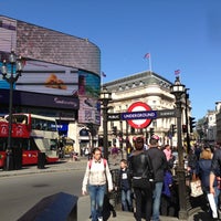 Photo taken at Piccadilly Circus by Olya S. on 5/4/2013