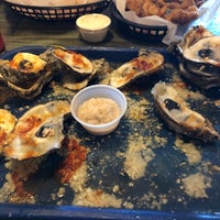 Photo taken at Shuckums Oyster Pub &amp;amp; Grill by B B. on 7/20/2019