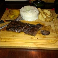 Photo taken at La Parrilla Colombian Steakhouse by Frankie V. on 12/15/2012