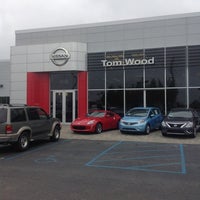 Photo taken at Tom Wood Nissan by Bill B. on 7/28/2014