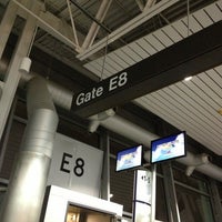 Photo taken at Gate E8 by Teresa J. on 12/29/2012