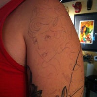 Photo taken at Hidden Los Angeles Tattoo &amp;amp; Fine Art by Jemma L. on 11/24/2012