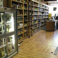 Photo taken at Seward Park Liquors by Lisa on 10/11/2012