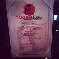 Photo taken at Takumi Sushi Lounge by Janet P. on 3/28/2014