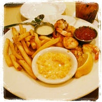 Photo taken at Rockfish Seafood Grill by Julia Y. on 12/21/2012