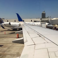 Photo taken at Gate 83 by Christopher W. on 8/20/2015