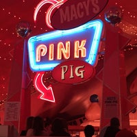 Photo taken at Macy&amp;#39;s Pink Pig by Kelly C. on 12/24/2014