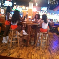 Photo taken at Hooters by Xku X. on 5/4/2013