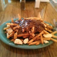 Photo taken at Poutine Dog Cafe by Angie B. on 12/30/2012