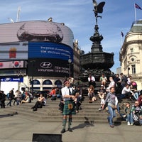 Photo taken at Piccadilly Circus by Melda Y. on 4/23/2013