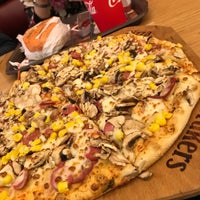Photo taken at Crakers Pizza by . on 3/7/2020