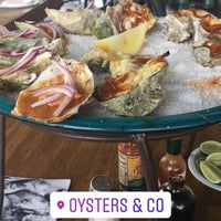 Photo taken at Oysters &amp;amp; Cõ by Michelle C. on 8/11/2018