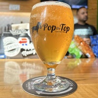 Photo taken at Pop the Top Craft Beer Shop by Christian R. on 9/14/2022