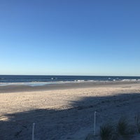 Photo taken at Neptune Beach by Alexi S. on 10/30/2018