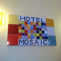 Photo taken at Mosaic Hostel by Kendra S. on 7/20/2014