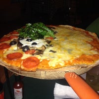 Photo taken at Osteria Marguerita. Pizza a La Leña by Iris C. on 7/22/2014