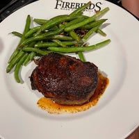 Photo taken at Firebirds Wood Fired Grill by Thomas B. on 5/24/2021