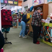 Photo taken at Quilting Adventures by Amanda S. on 1/1/2015