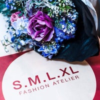 Photo taken at S.M.L.XL fashion atelier by Dima G. on 12/13/2013