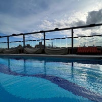 Photo taken at Gansevoort Rooftop Swimming Pool by Ryan A. on 2/17/2022