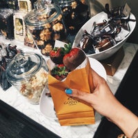 Photo taken at Godiva Chocolatier by Nina K. on 7/9/2015