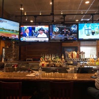Photo taken at Smokey Bones Bar &amp;amp; Fire Grill by April S. on 2/15/2019